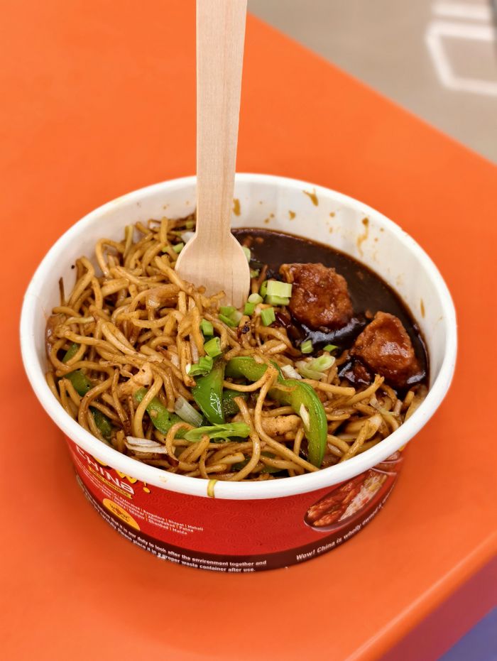 about-02 Savor spicy Indo-Chinese chow mein with fresh vegetables and chicken in Kottiyam.